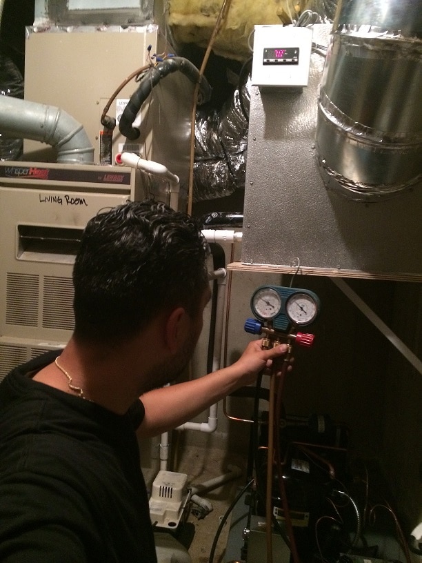 Mario Morales, Owner of M&M Cellar System Taking Pressure Readings New JErsey Project