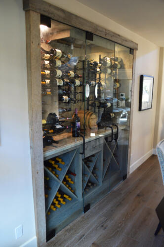 8 Store your favorite wine bottles under the custom made wooden racking for this NJ wine cellar