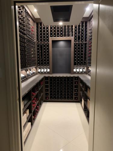 Transitional-home-wine-cellar-with-stained-wooden-racking